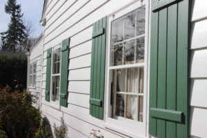 Wood Storm Sash with dark shutters